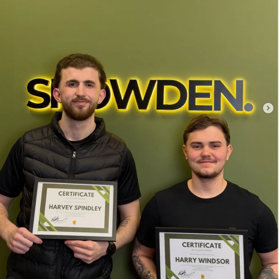 Snowden Academy students holding certificates after their training