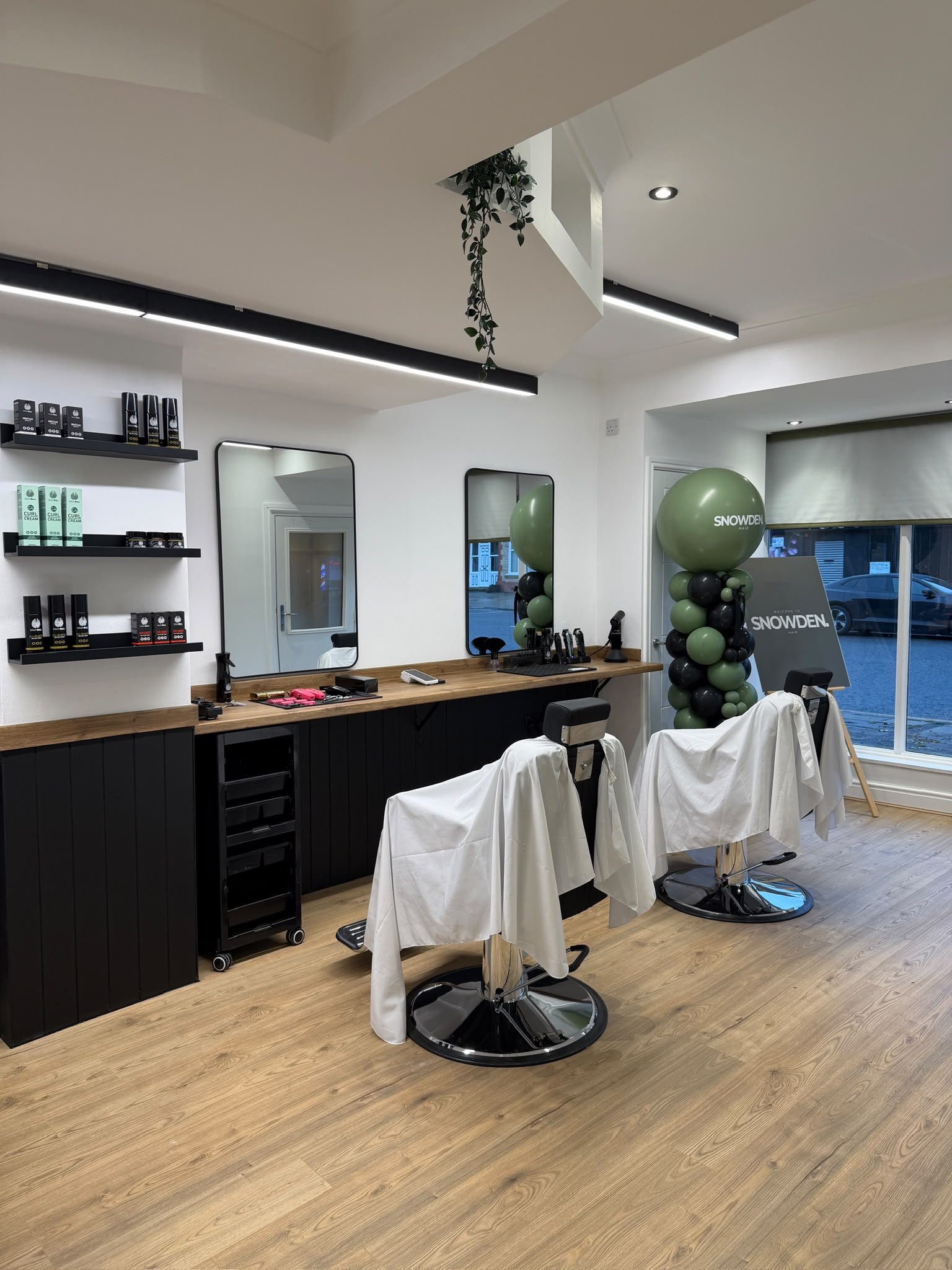 Barber chairs, mirrors and timber workstations inside Snowden Hair on Oswald Road