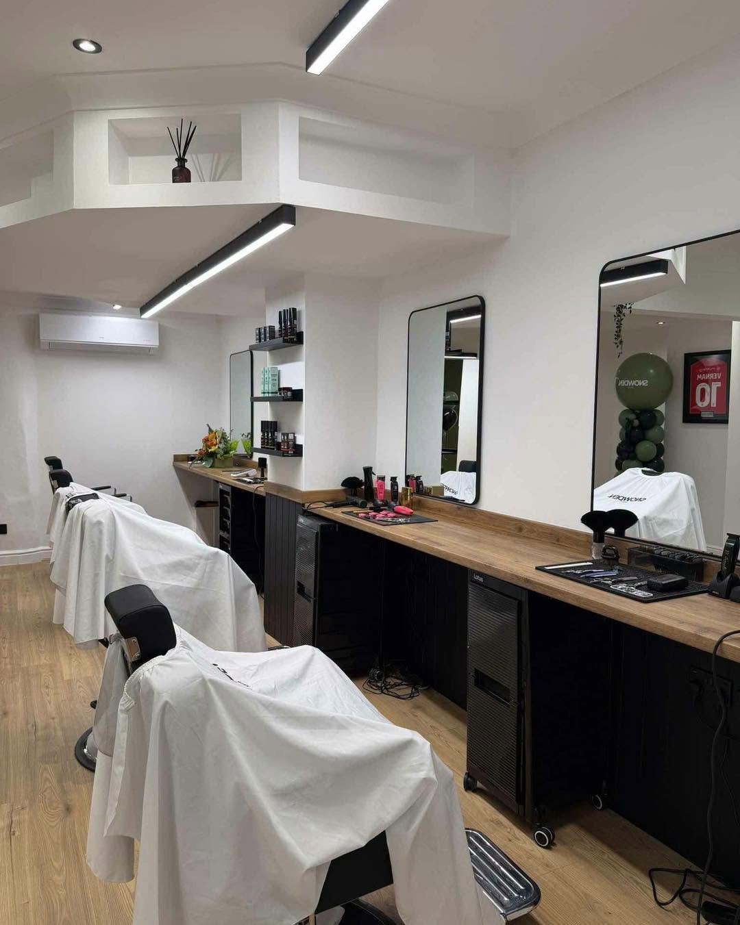 The row of cutting stations and mirrors in the new Snowden Hair shop