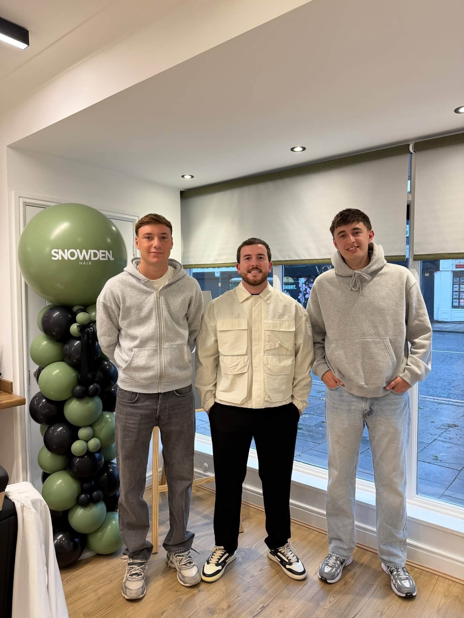 The Snowden Hair team together inside the shop at 45 Oswald Road.